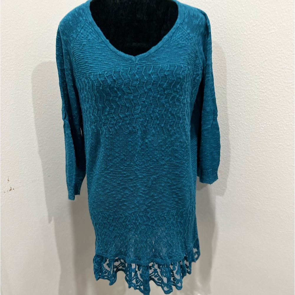 Blue American Rag sweater with lace detail on bottom.